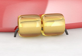 Gold bead in front of the cabochon 